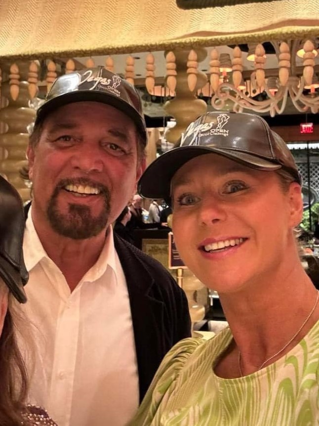 2 people wearing Vegas cap