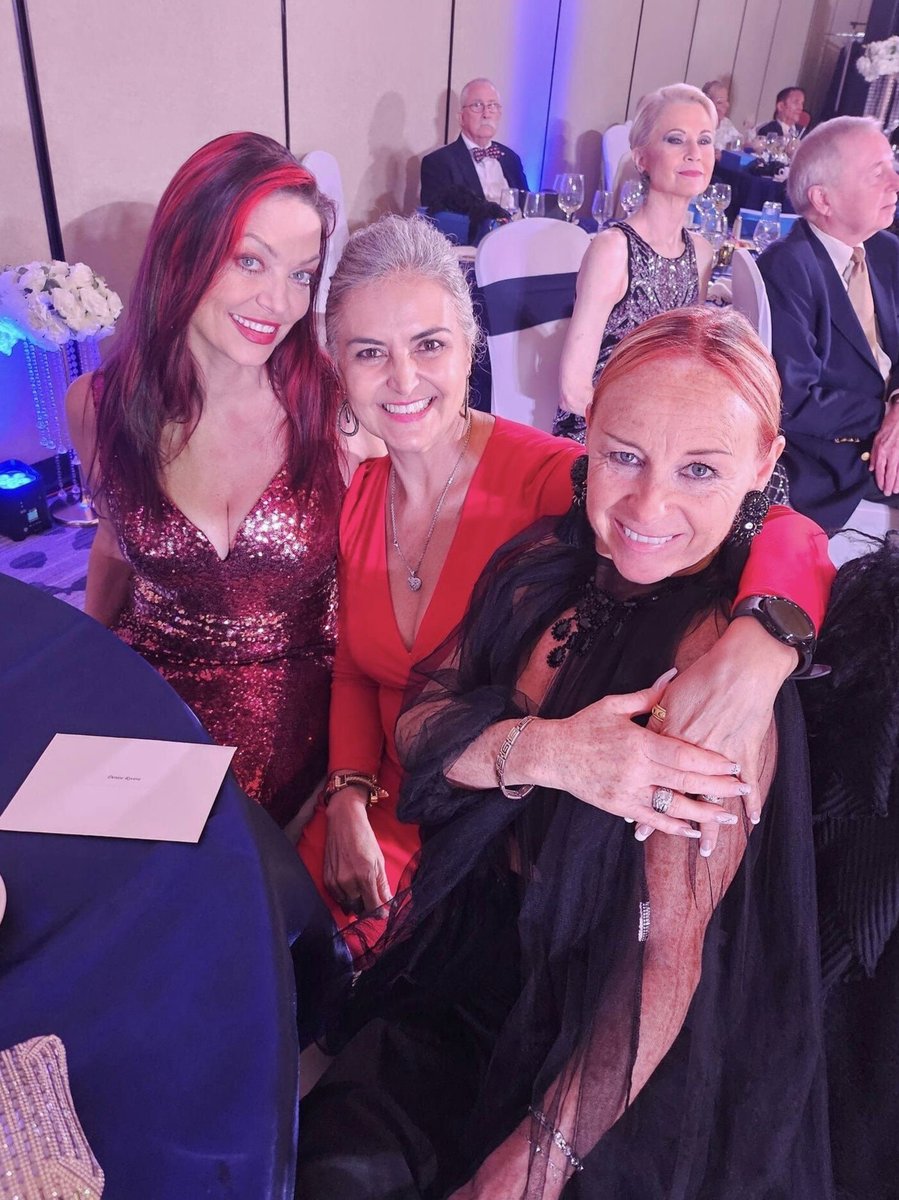 Three ladies in fiery dresses
