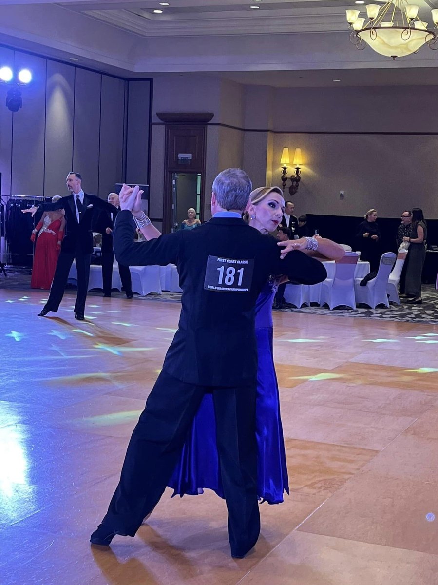 A pair dancing on dancefloor