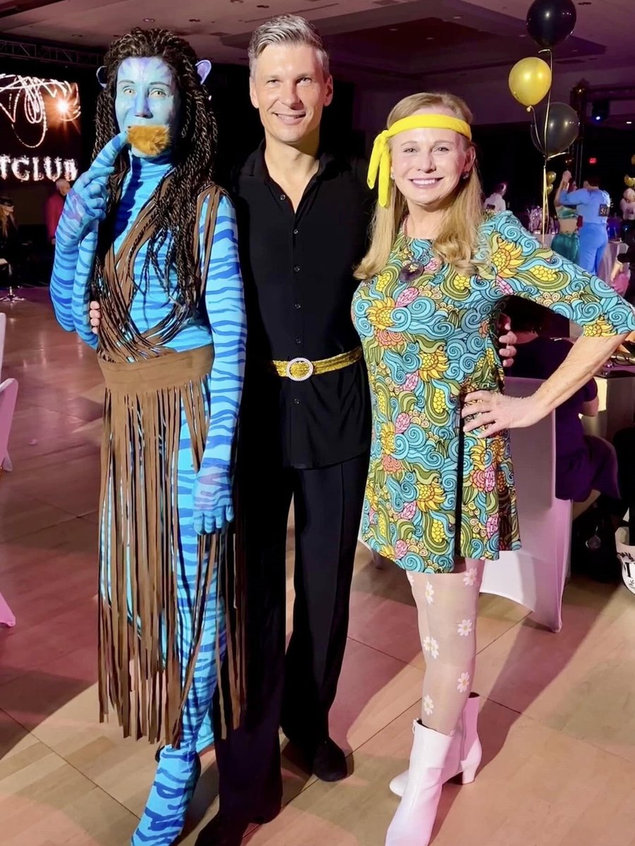3 attendees of Elite dancesport in their halloween costume
