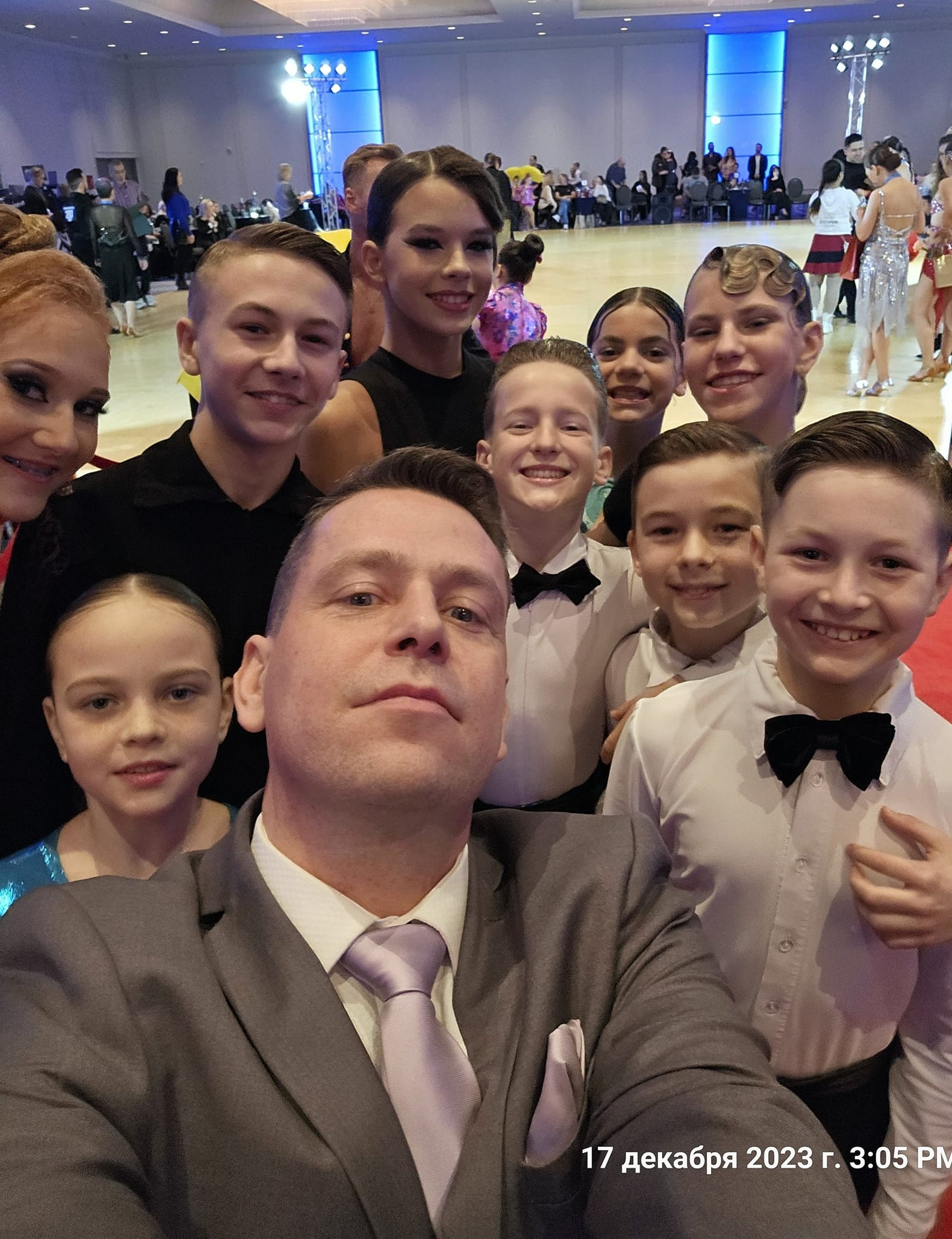 Group picture of coach and competitors